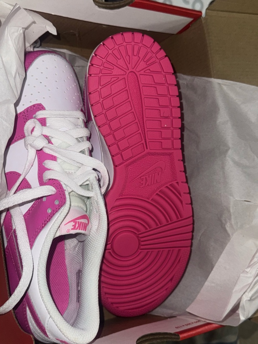 Nike Women’s Low-Top DUNK Sneakers in Hot Pink and White.